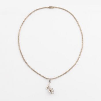 18K white gold shoe pendant with faceted white stones, silver chain.
