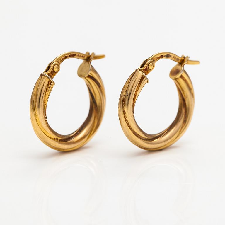 A pair of 14K gold earrings. Italy.