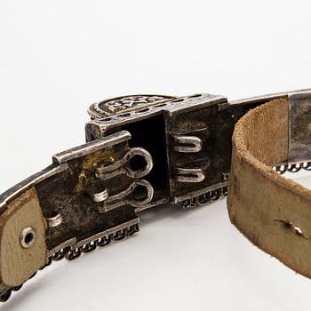 A Caucasian parcel-gilt costume belt with niello decor, 1908-26.
