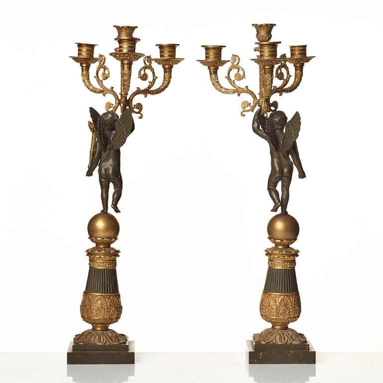 A pair of French Empire early 19th century four-light candelabra.