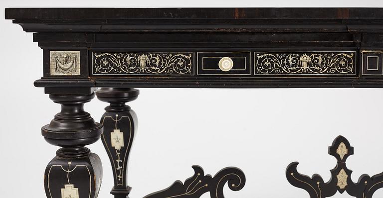 A Renaissance-style ebony, ebonized and ivory-inlaid library table, late 19th century, presumably Germany.