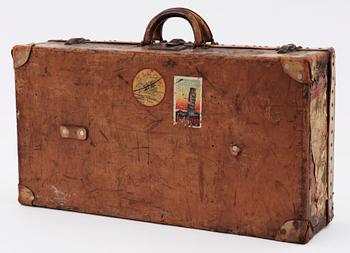 A late 19th cent leather suitcase by Louis Vuitton.