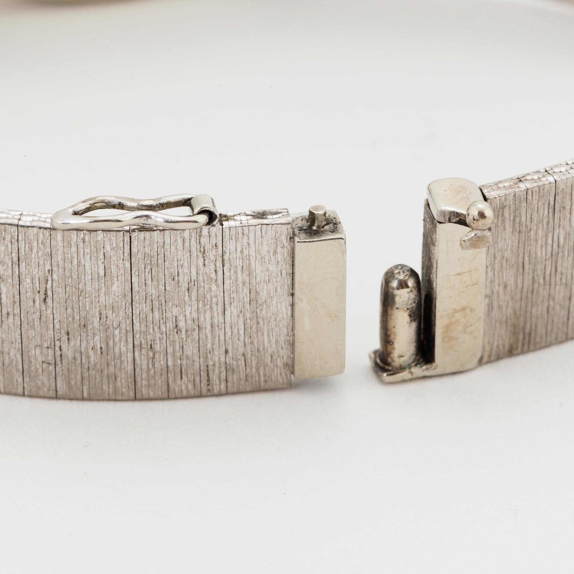 A Movado 18K white gold ladies watch.