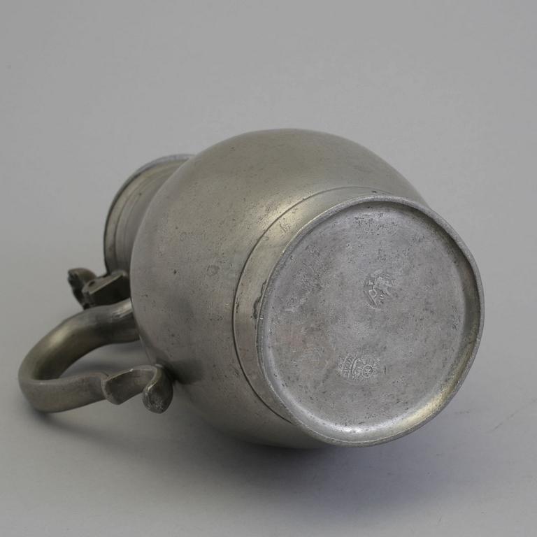 A 18th century tin pot.