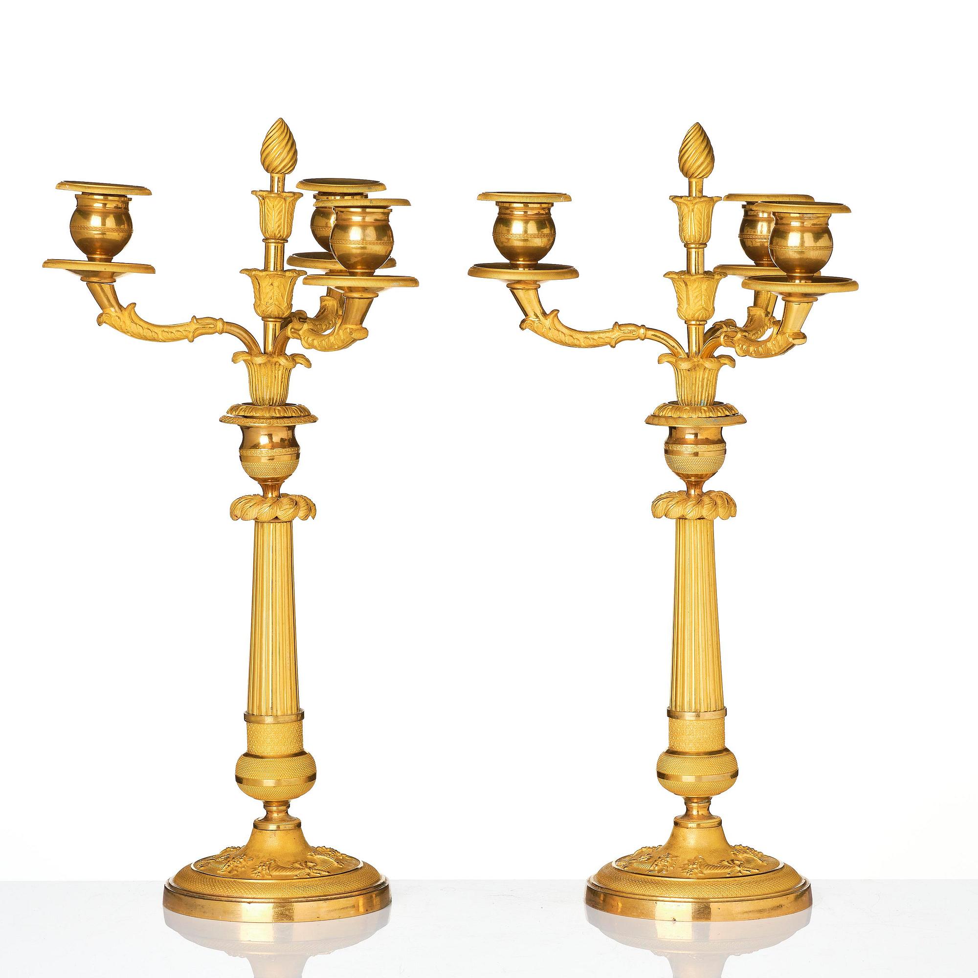 A pair of Empire ormolu three light Candelabra.