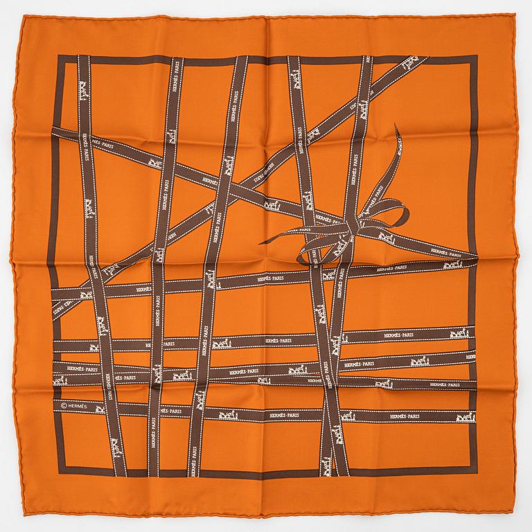 Hermès, a 'Jumbo' leather bracelet and a silk scarf.