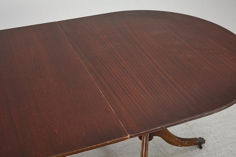 A dining table, 20th century, England.