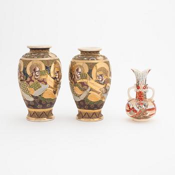 A pair of Japanese Satsuma vases and a vase with handles, 20th Century.