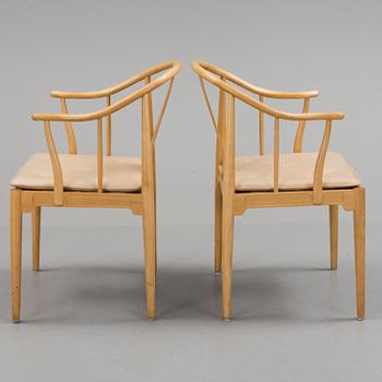 A pair of Hans J Wegner cherry 'China' chairs, Fritz Hansen, Denmark 1987.
