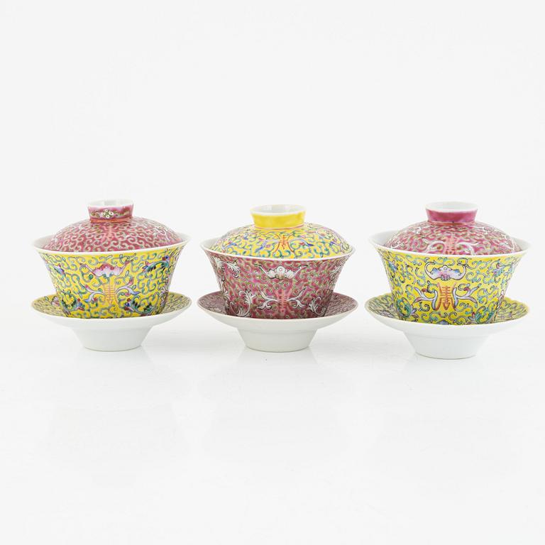 A group of three Chinese enamelled porcelain cups with covers and stands, three small dishes, 20th century.