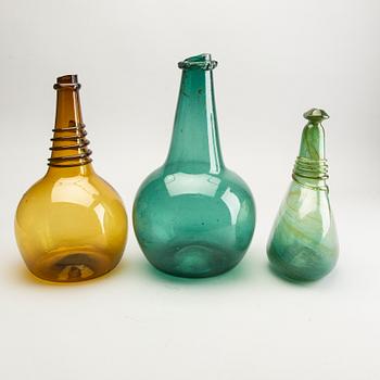 A group of five persian glass bottles and a ball, 19th/20th Century.