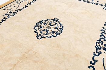 An antique Chinese carpet, 404 x 304 cm.