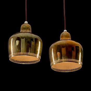 ALVAR AALTO, A SET OF TWO PENDANT LAMPS. A330, Golden Bell. Manufactured by Louis Poulsen & Co a/s Denmark.