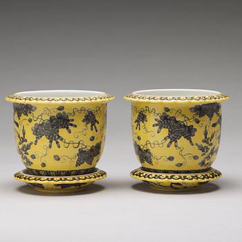 A pair of yellow glazed Dayazhai mark flower pots with stands, Republic, 20th Century.