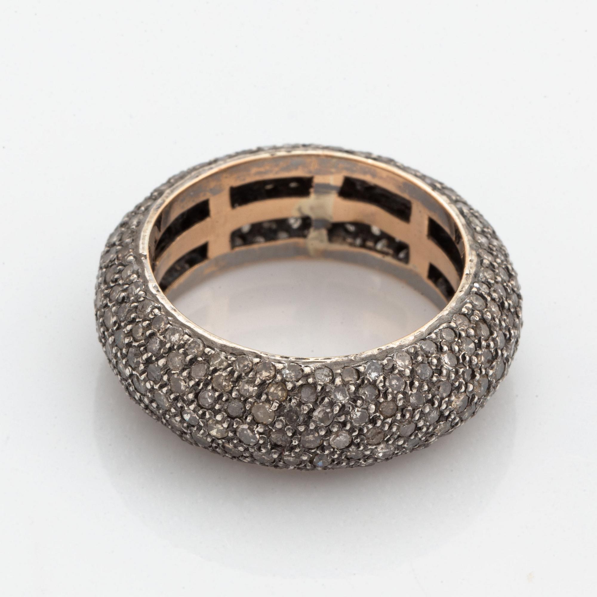 Silver and diamond ring.