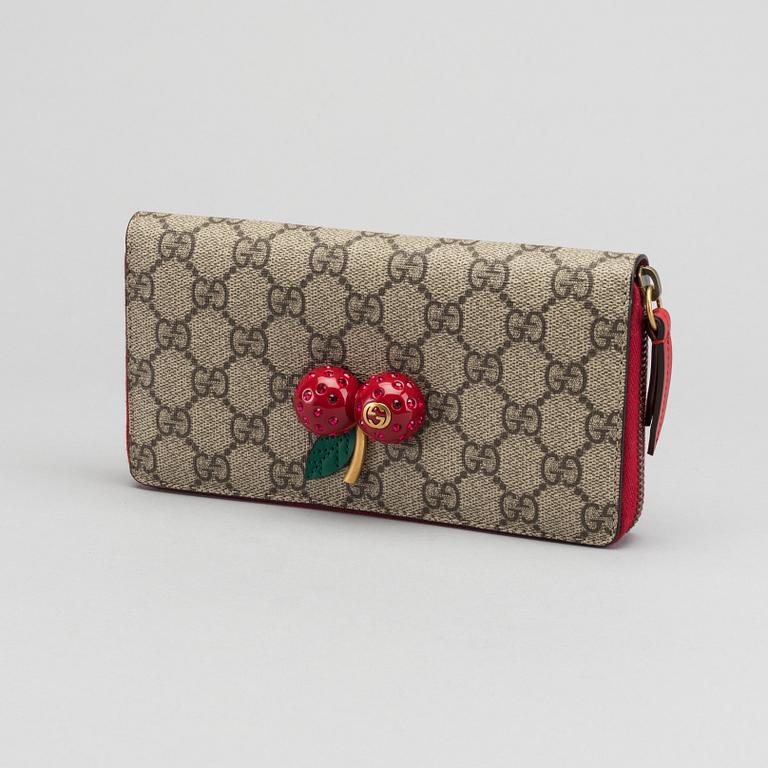 GUCCI plånbok.  "GG Supreme zip around wallet with cherries".