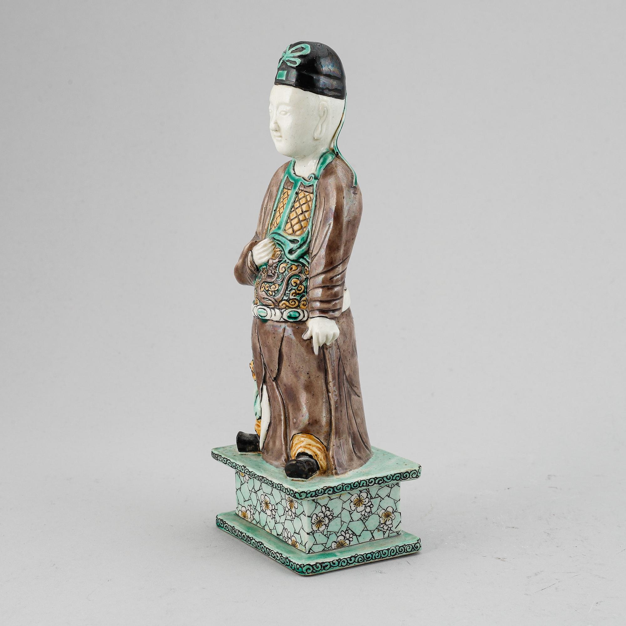 A porcelain figure of a scholar, Qing dynasty, 18th Century.