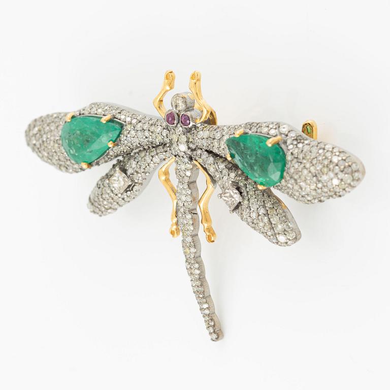 Brooch, in the form of a butterfly, silver and 14K gold set with emeralds, rubies, and princess-cut and octagonal-cut diamonds.