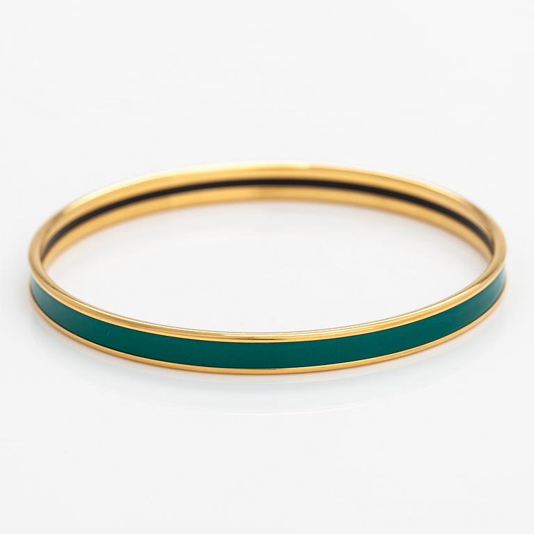 Hermès, a bracelet made of gold coloured metal and green enamel. Marked Hermès Paris, Made in France.