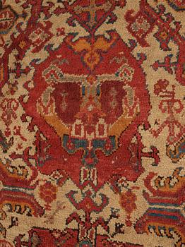 A CARPET. An antique Ushak. 554,5 x 480 cm.