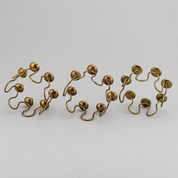 LARS HOLMSTRÖM, Three brass candelabra, Arvika, mid 20th Century.