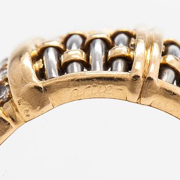 Cartier,an 18K gold and steel ring, with brilliant-cut diamonds.