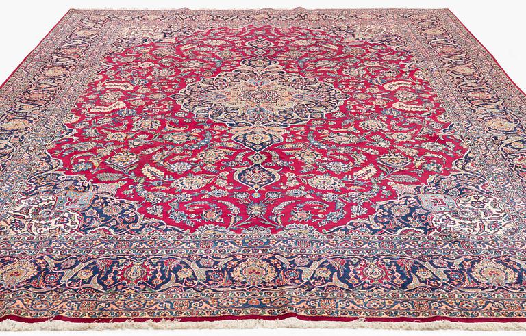 A semi-antique Kashan carpet, c 435 x 325 cm.