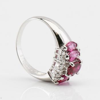 Ring in 850 platinum with navette-cut pink sapphires and round brilliant-cut diamonds.