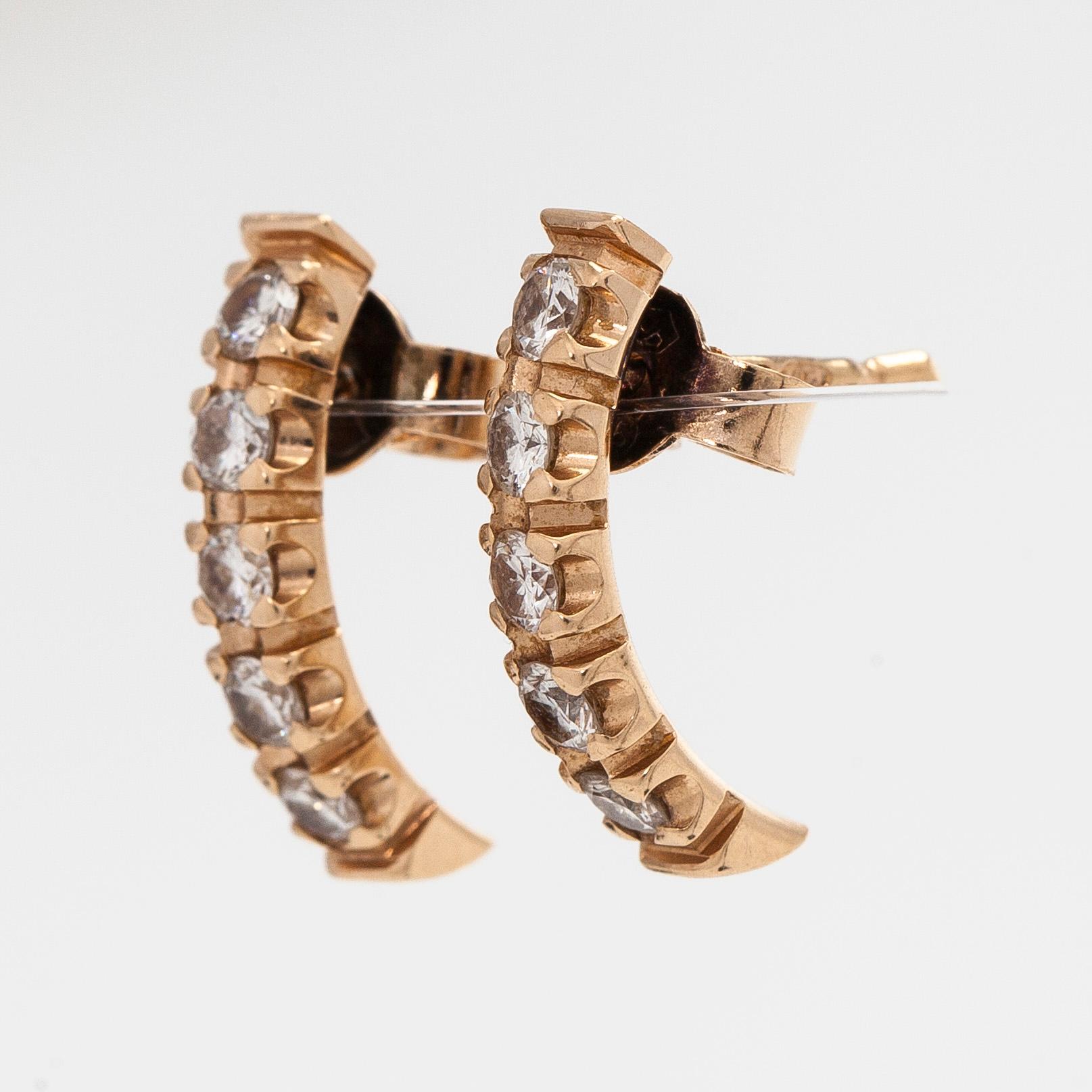 Korvakorut, 14K kultaa ja briljanttihiottuja timantteja.