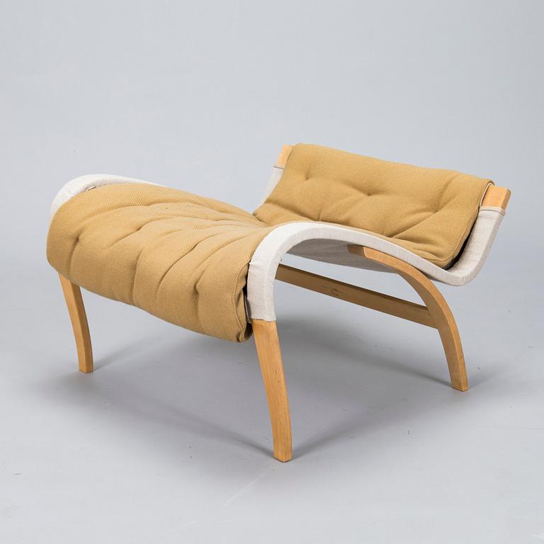 Bruno Mathsson, A "Pernilla" armchair with footstool, for DUX, designed in 1944.