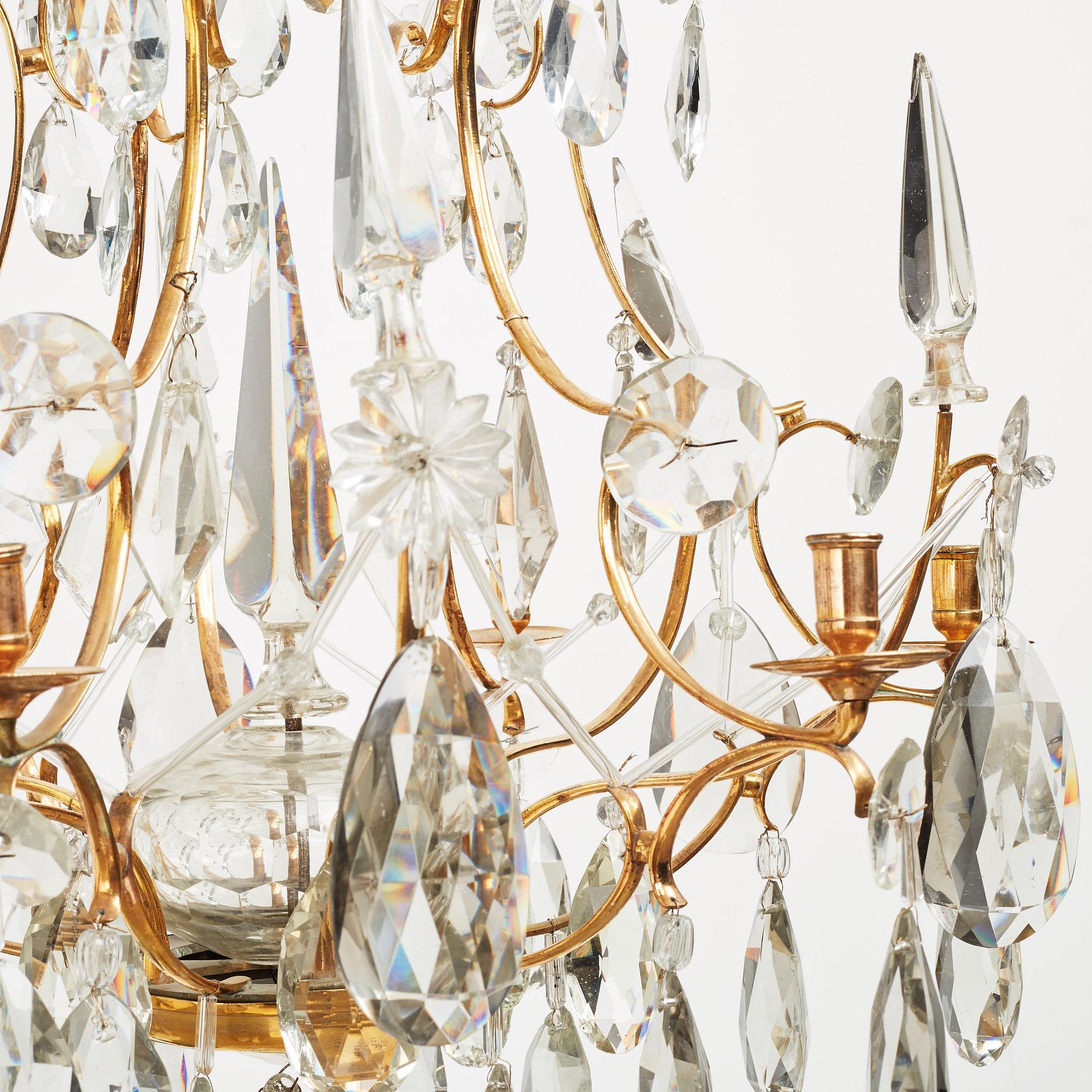 A pair of Swedish Rococo 18th century six-light chandeliers by Olof Westerberg dated 1789 and 1790.