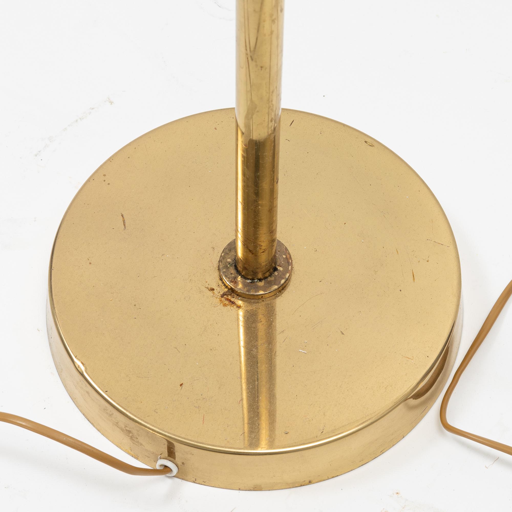 A pair of model 'G-18' brass floor lights, Bergboms, second half of the 20th Century.