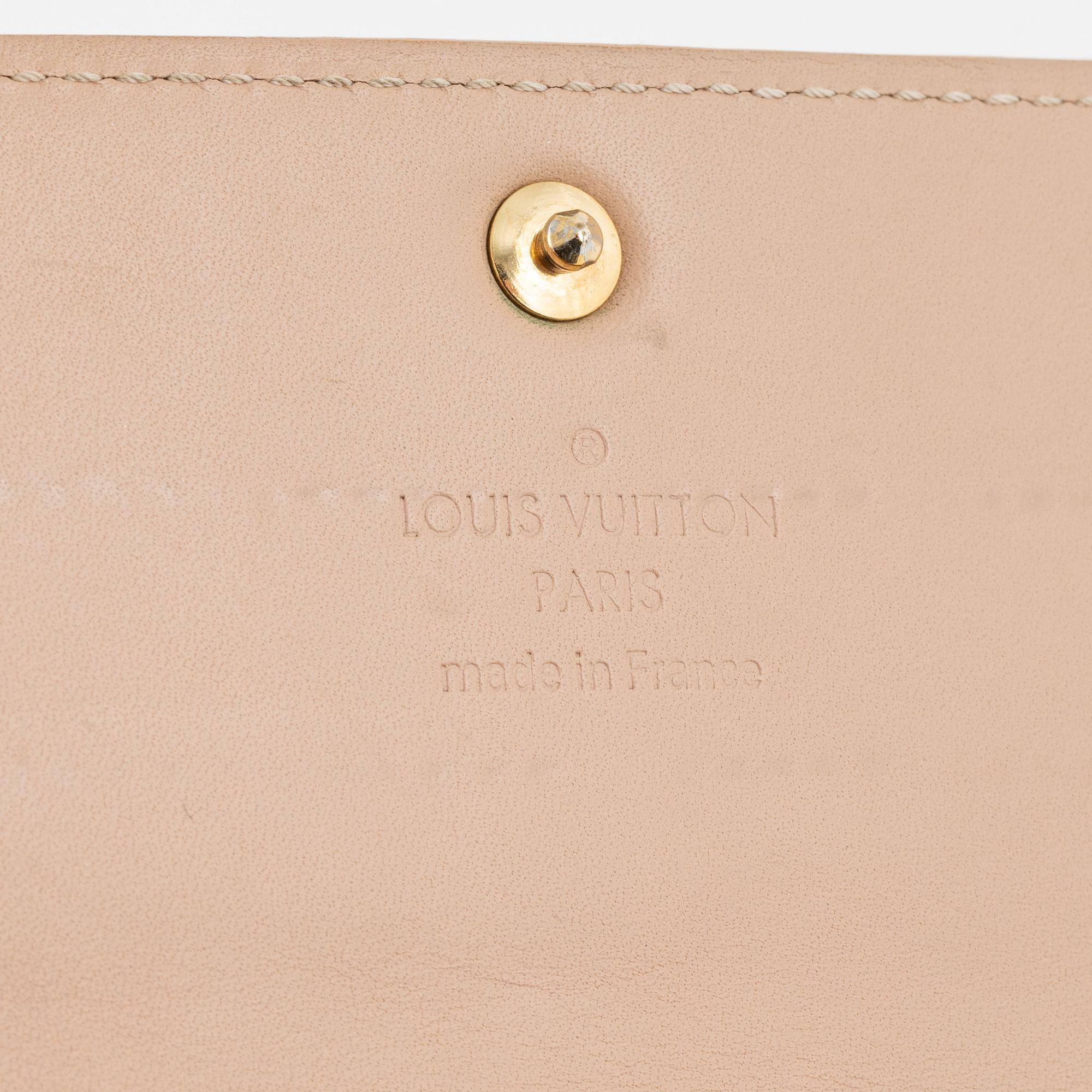 Louis Vuitton, a 'Sarah' vernis wallet.