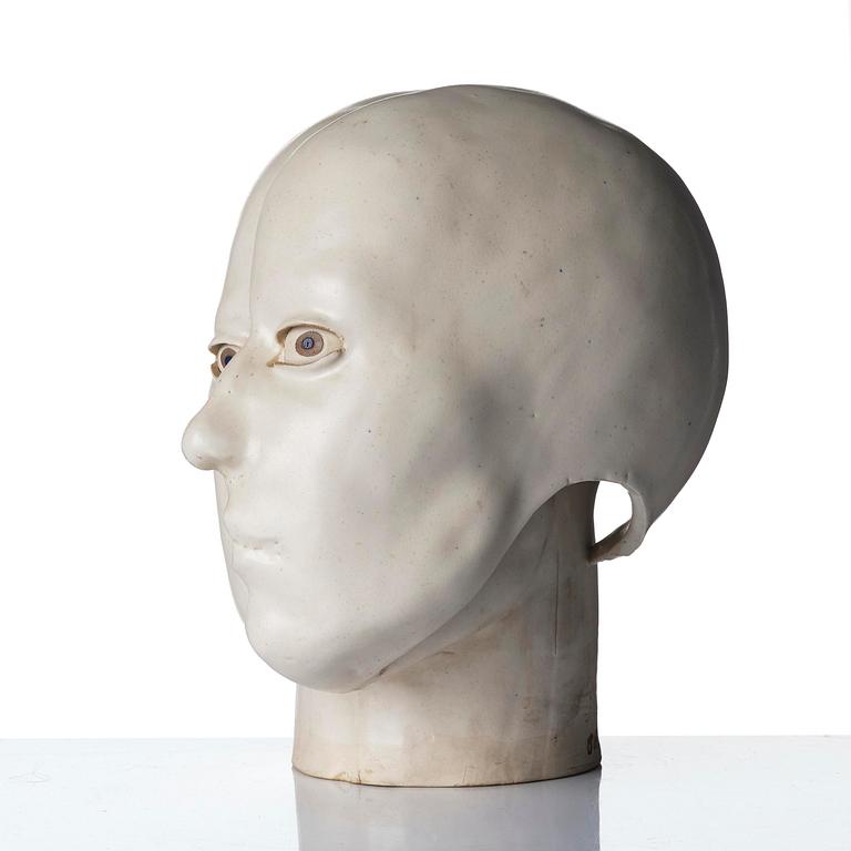 Britt-Ingrid "BIP" Persson, a glazed stoneware sculpture of faces, ca. 1970.