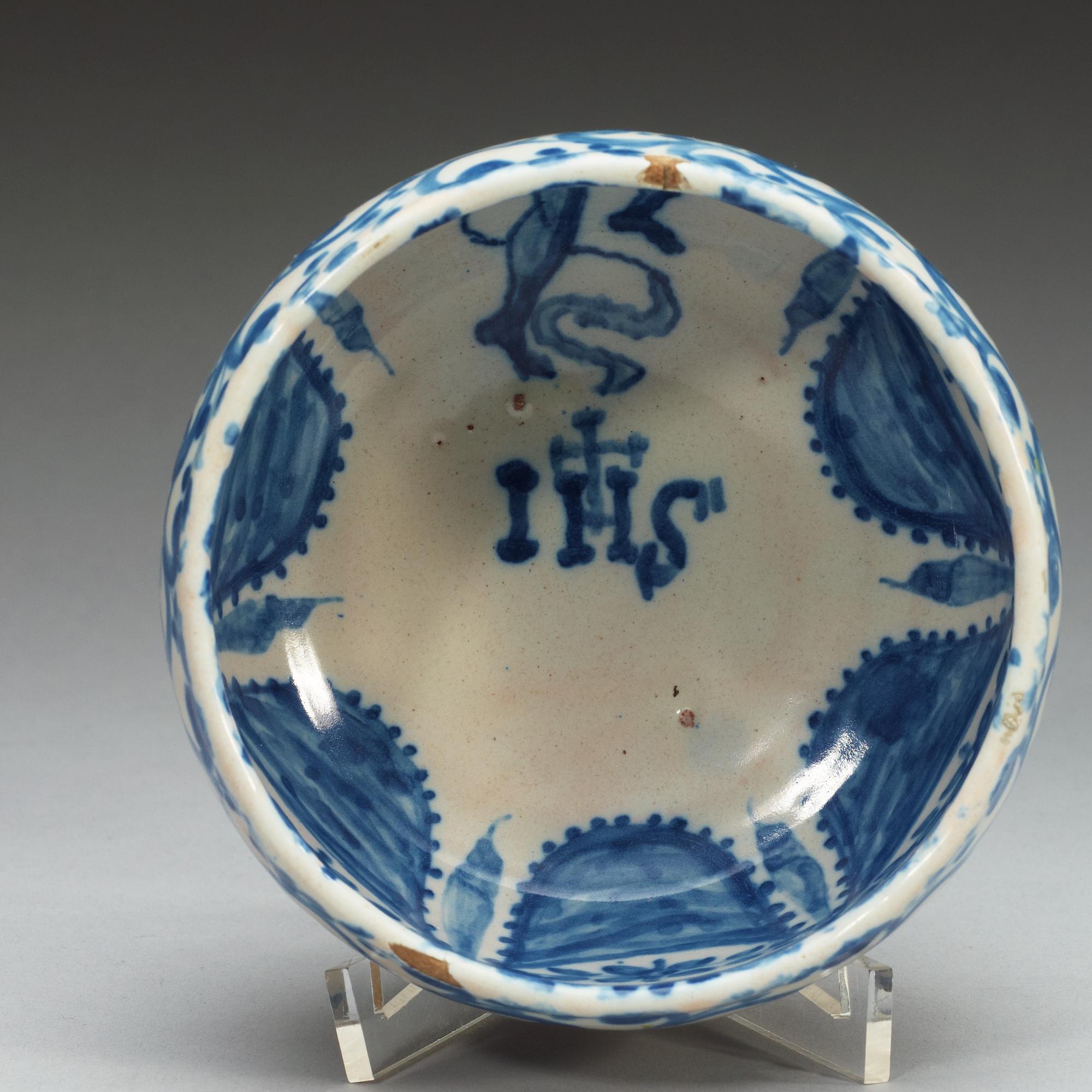 A Spanish faience blue and white bowl. Marked Talavera, presumably 18th Century.