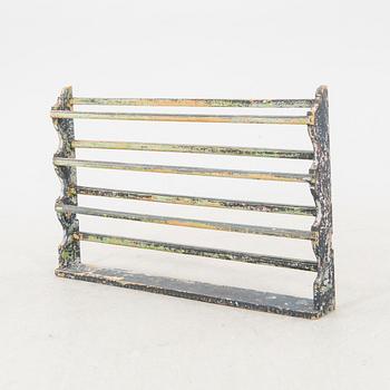 A painted early 1900s shelf.