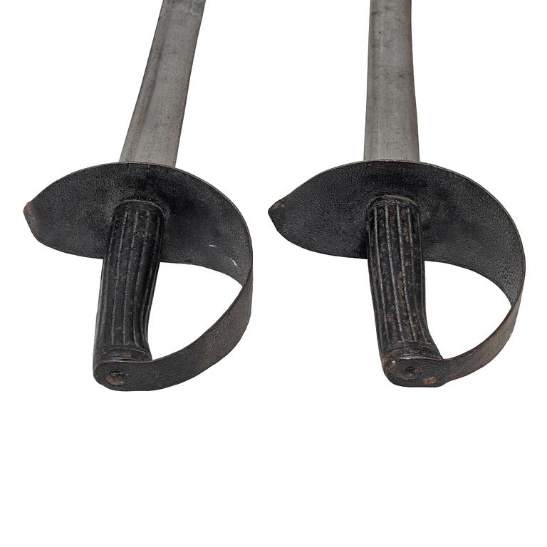 Two 19th century naval cutlasses.