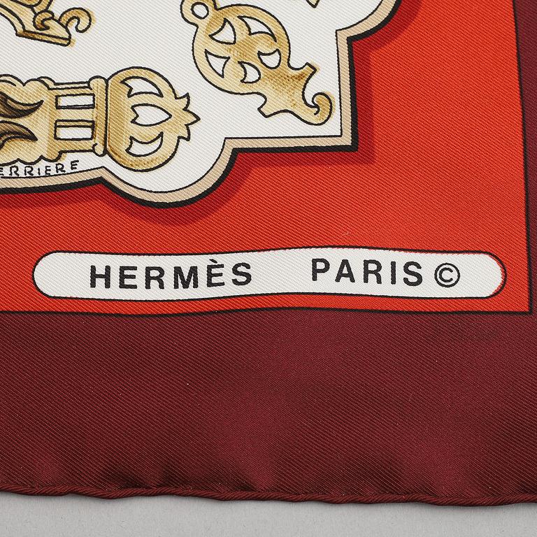 Hermès, a 'Les Eperons' silk scarf.
