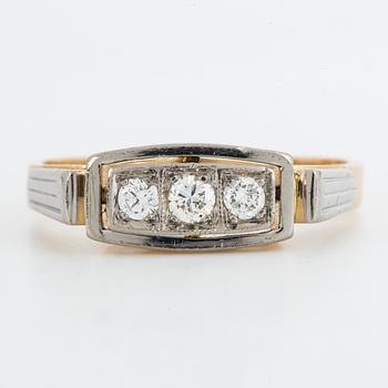18K gold and brilliant-cut diamond three-stone ring.