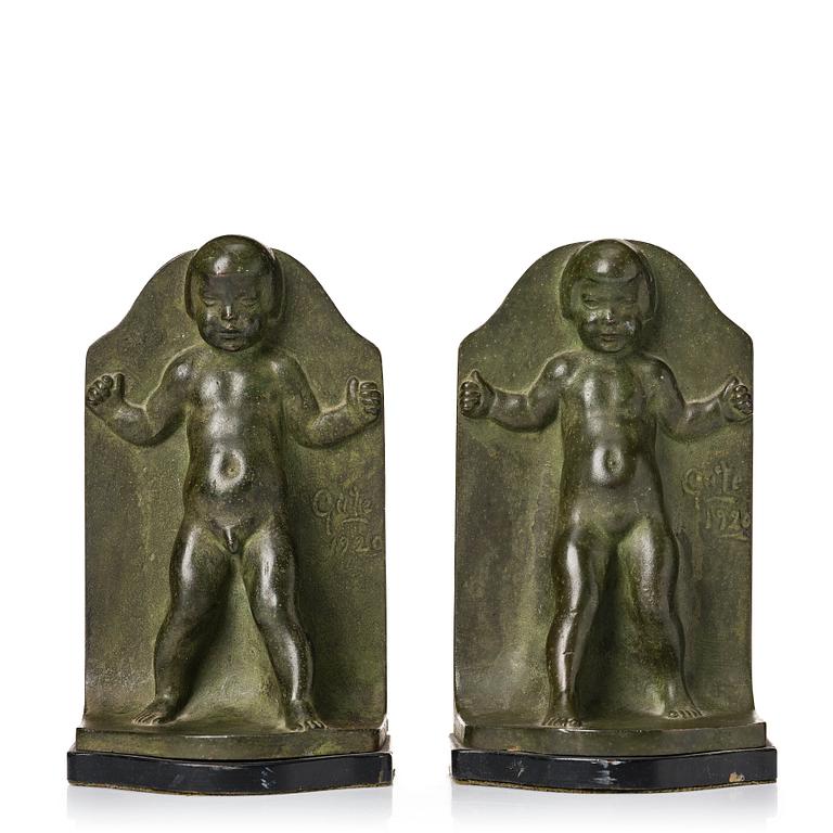 Axel Gute, a pair of green patinated metal bookends, Sweden, dated 1920.