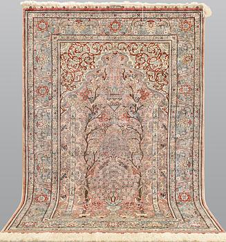 A figural Oriental silk carpet, approx. 155 x 93 cm.