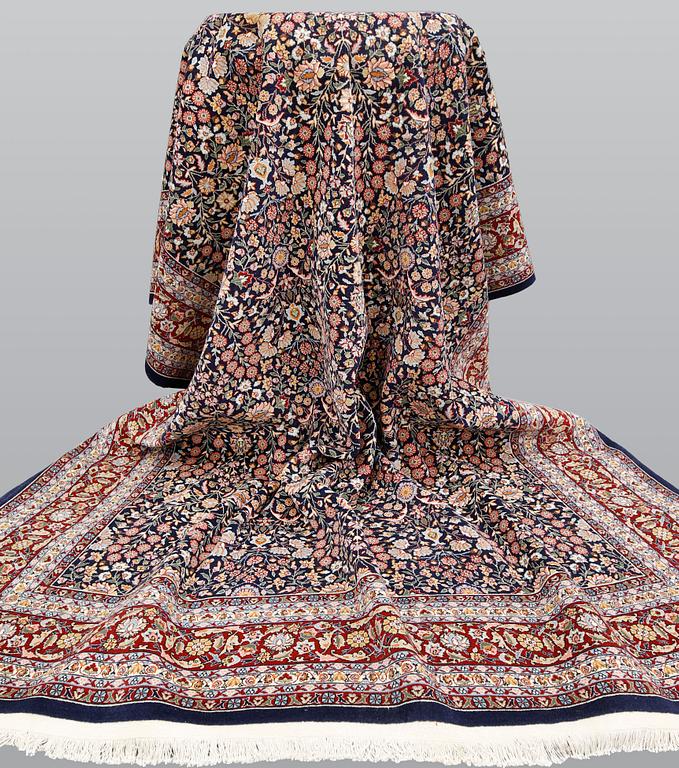 A signed Hereke carpet, ca 340 x 246 cm.