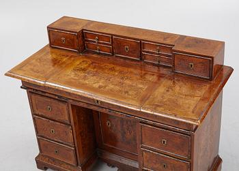 A Swedish late Baroque alder-veneered 'knee-hole' writing desk, first part of the 18th century.