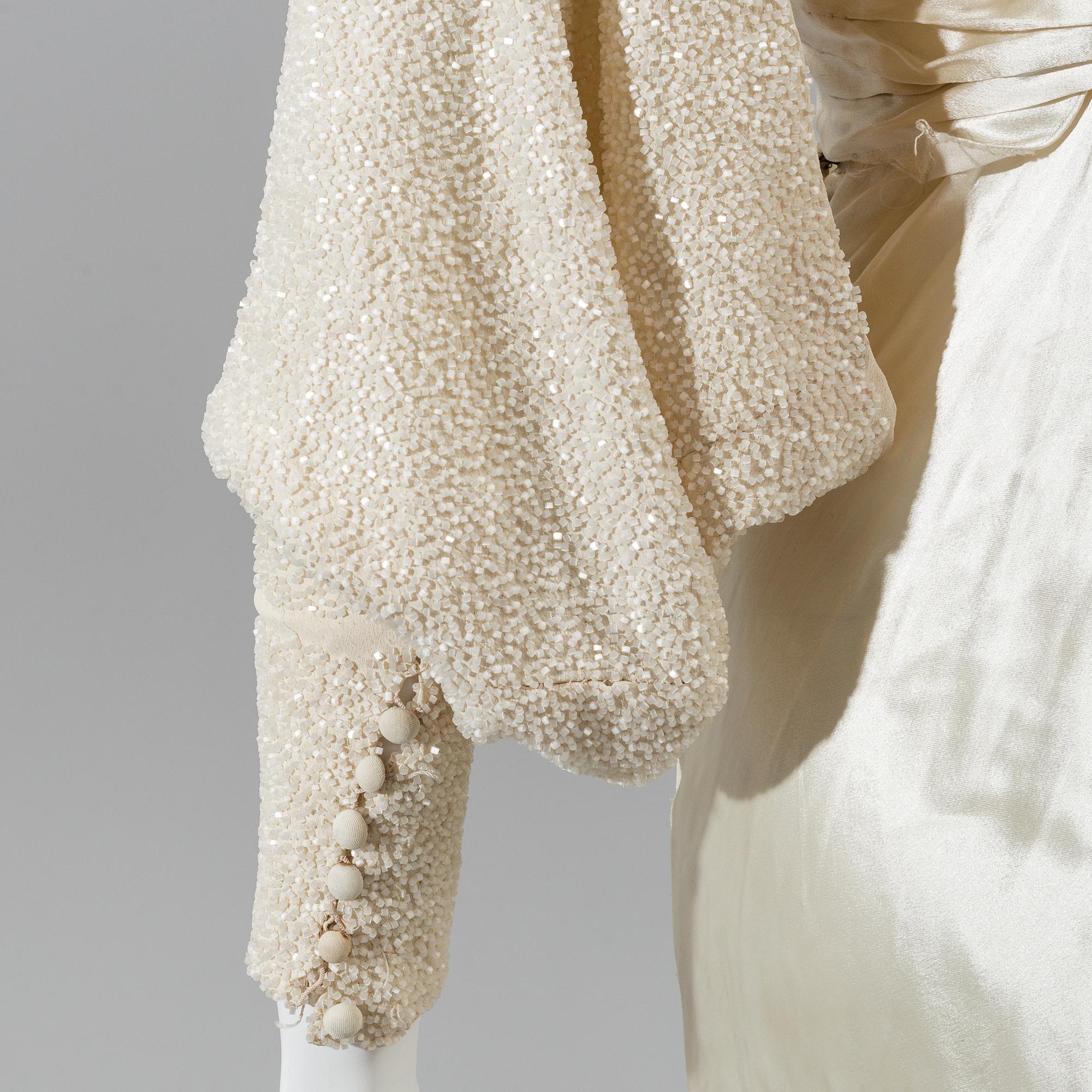 A satin wedding dress, circa 1935.