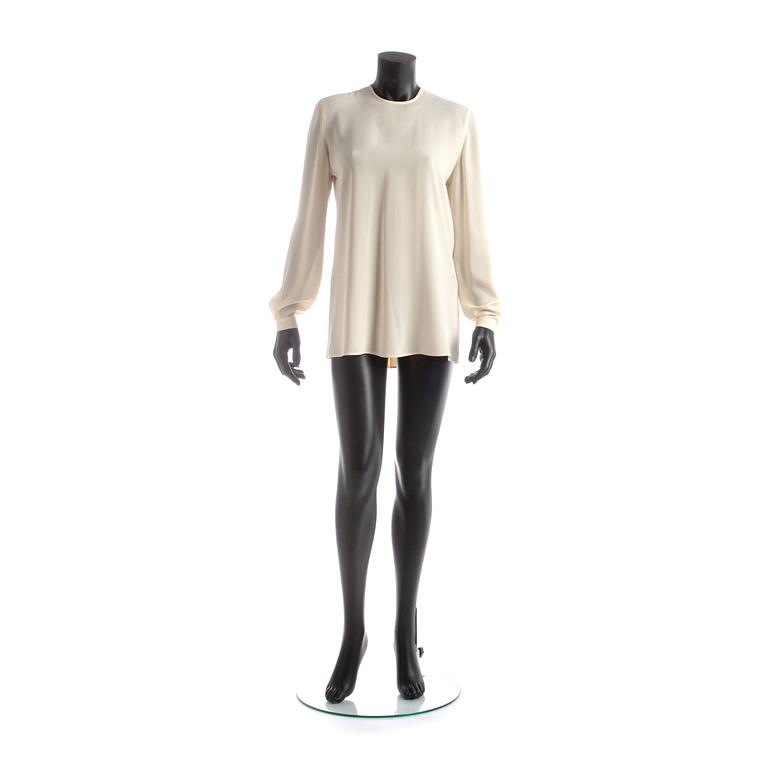 GIORGIO ARMANI, a light beige silk blouse.