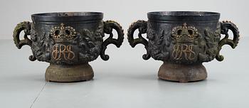 A pair of Swedish cast iron garden urns with Royal monogram, probably second half 19th century.