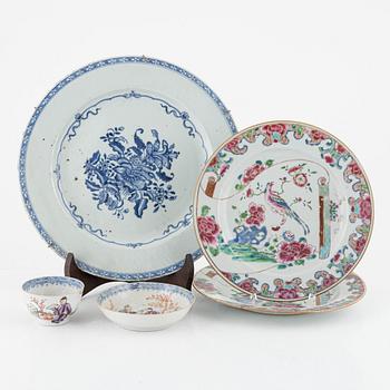 A pair of Famille rose porcelain plates, a cup with saucer and a blue and white charger, China, 18th century.