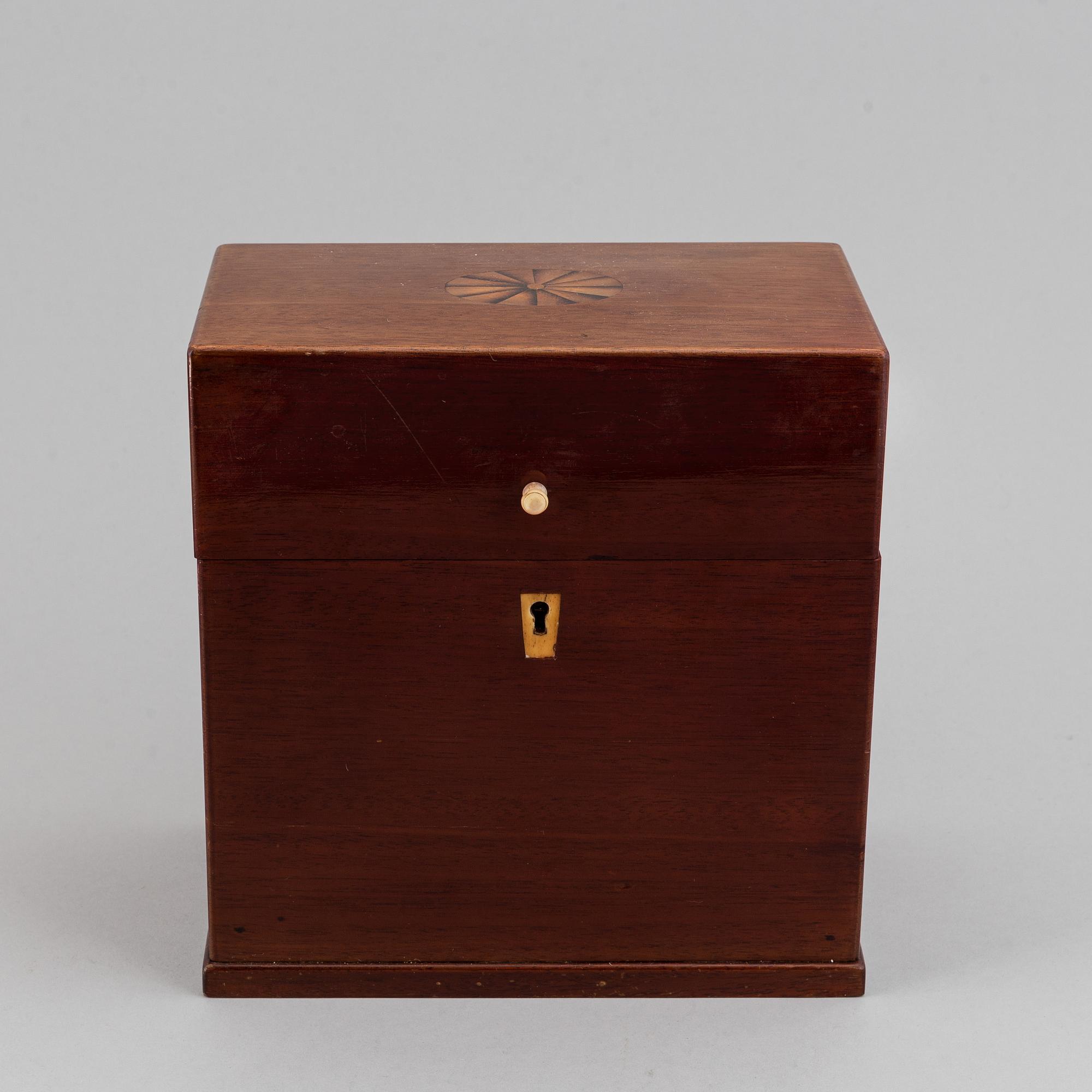 A late Empire mahogany box with three glass bottles, mid 19th Century.