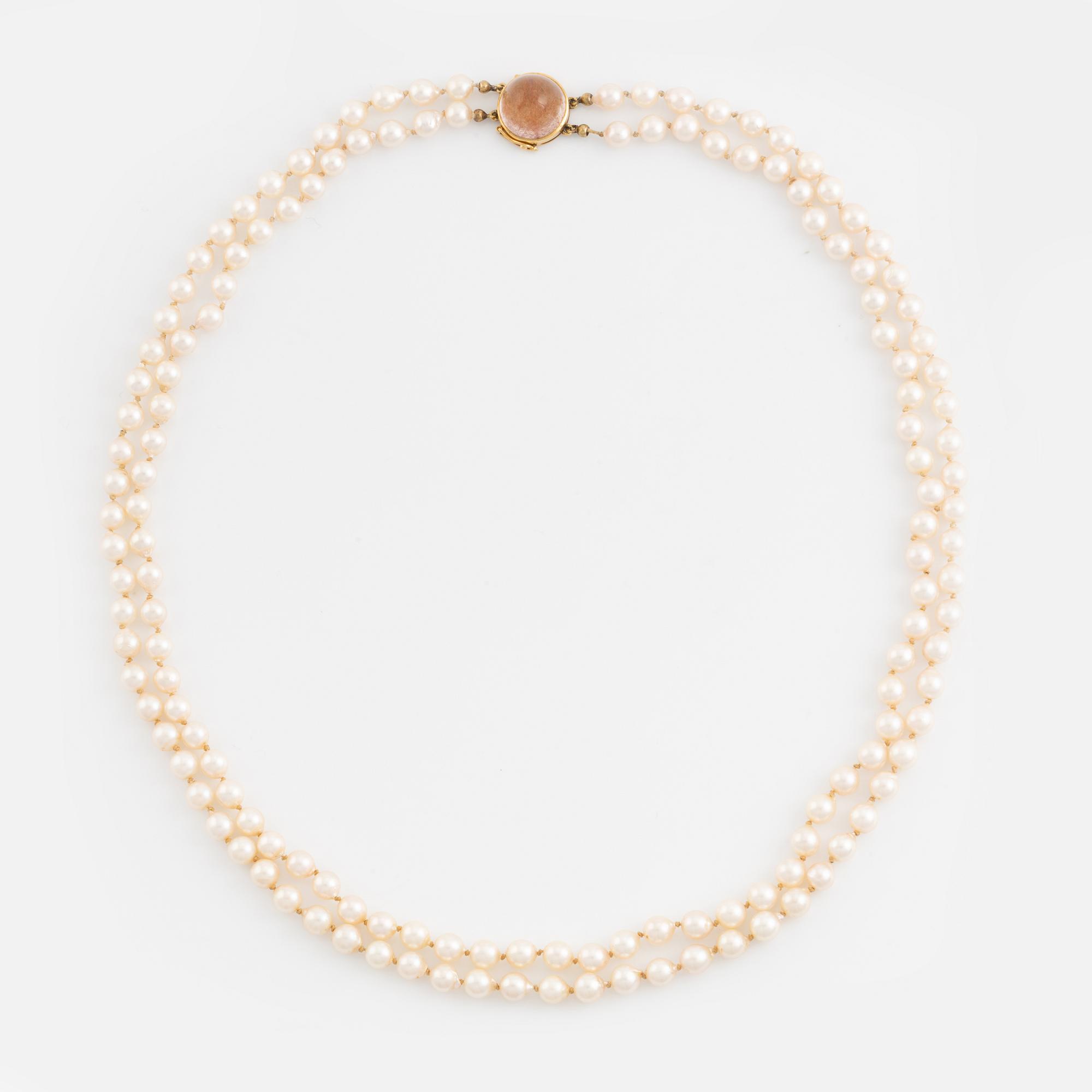 Two strand cultured pearl necklace, 18K gold clasp with rutile quartz.