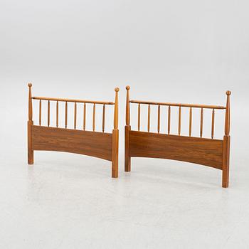 A pair of head-and foot boards to two beds, mid 20th century.